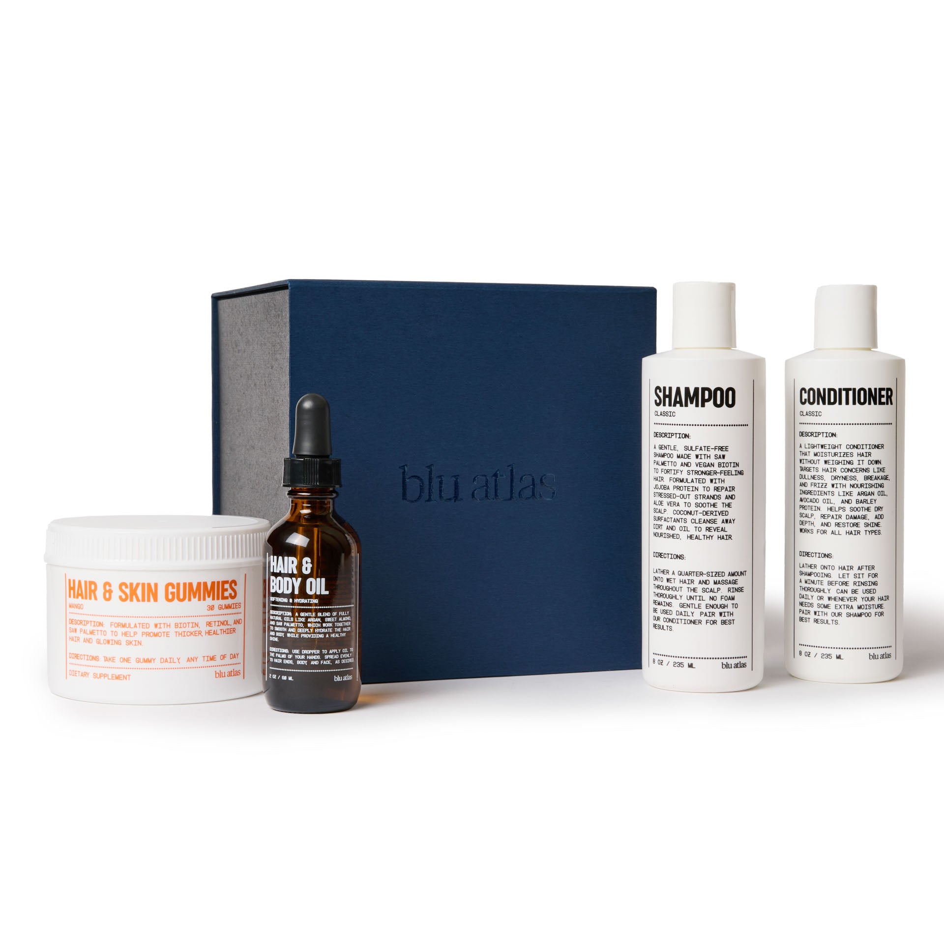 The Ultimate Hair Care Set by Blu Atlas showcases a collection of hair and skincare products made with clean ingredients, featuring hair and skin gummies, nourishing hair and body oil, rejuvenating shampoo, and conditioner, all beautifully arranged with a blue box in the background.