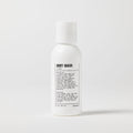 A white plastic bottle labeled Blu Atlas Travel Size Body Wash with black text stands upright on a plain background. This daily body wash is formulated as a gentle cleanser for everyday use.