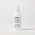 A travel-sized white bottle of Blu Atlas Travel Size Conditioner with a printed label showing product details and instructions on the front, set against a plain white background.