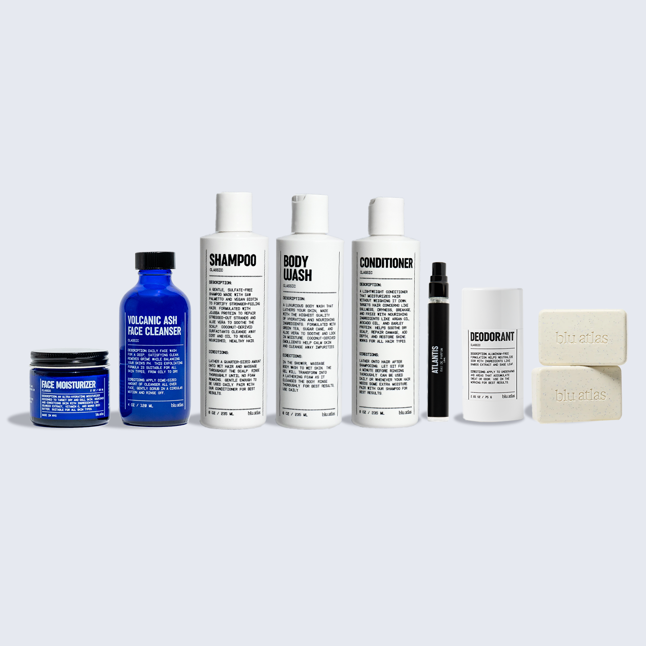 The Blu Atlas Welcome Bundle features a complete mens grooming set—including cleanser, moisturizer, shampoo, body wash, conditioner, deodorant, cologne, and two soap bars—arranged on a light background.