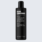 A stylish black bottle of Blu Atlas Beard Conditioner, infused with nourishing Argan Oil, showcases white text that outlines the ingredients and instructions aimed at repairing damage and promoting healthier facial hair.