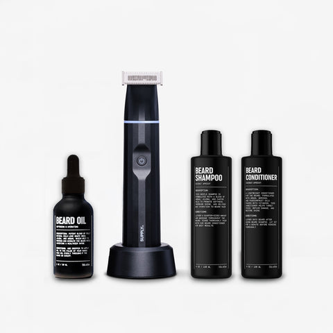 Discover the ultimate beard grooming experience with the Beard Refresh Bundle from Blu Atlas. This set features an electric trimmer, beard oil, beard shampoo, and conditioner, all enhanced with a refreshing Coconut Apricot scent, beautifully arranged against a plain background.