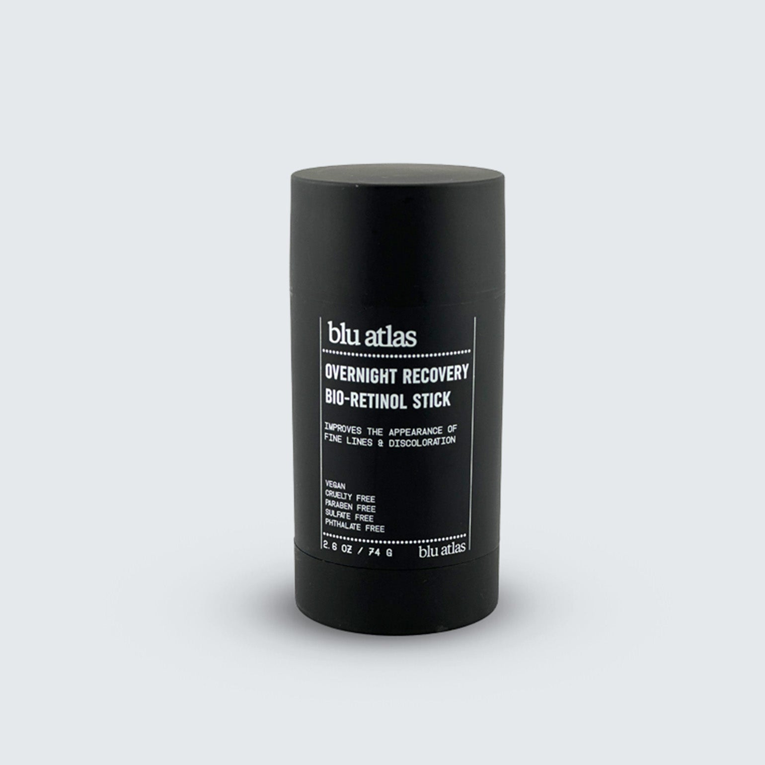A black cylindrical Blu Atlas Bio-Retinol Stick stands upright on a plain light gray background.