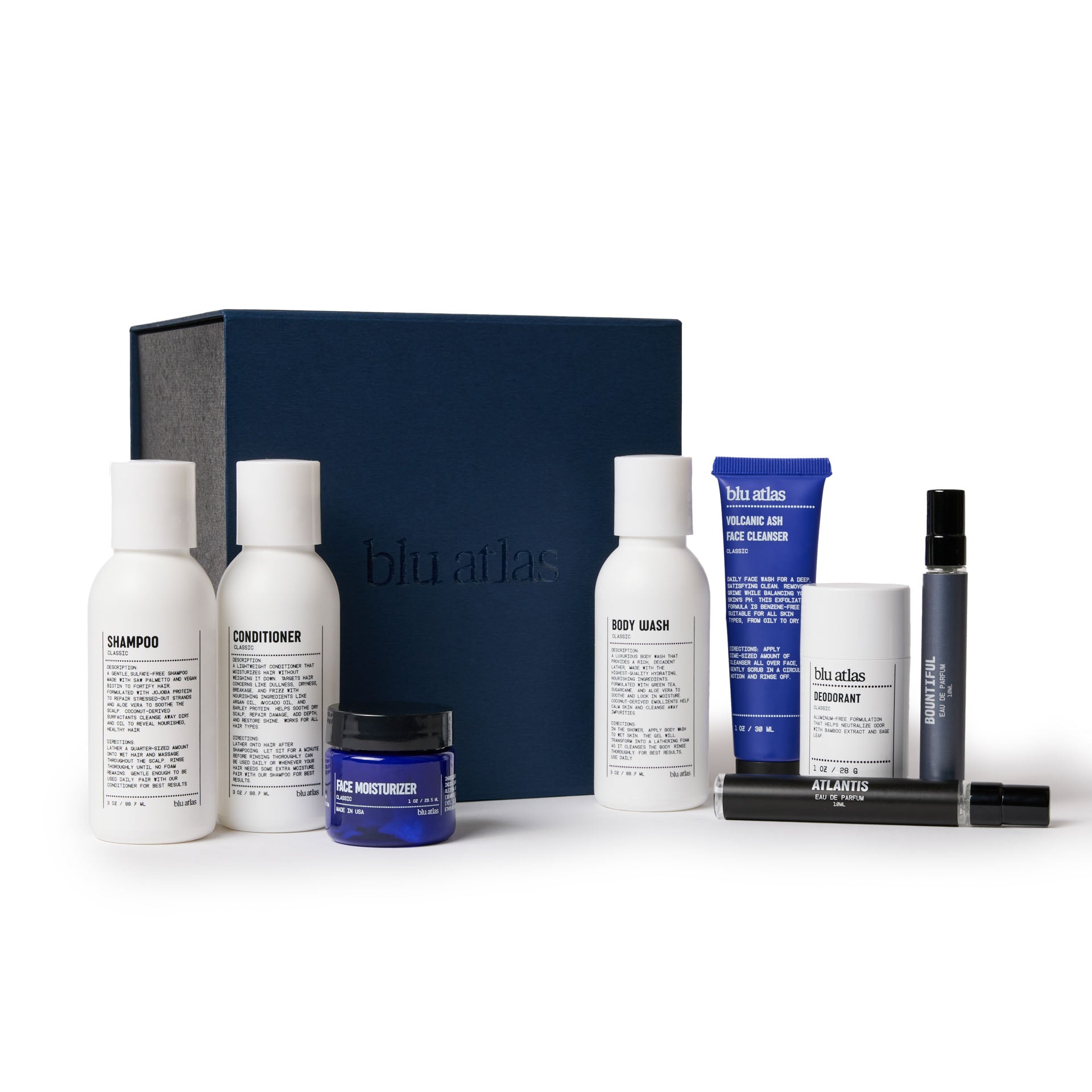 The Mini MVP Grooming Essentials Bundle by Blu Atlas showcases a collection of limited-edition products, including shampoo, conditioner, body wash, face moisturizer, deodorant, and cleanser. Each item is beautifully displayed in front of a dark blue box.