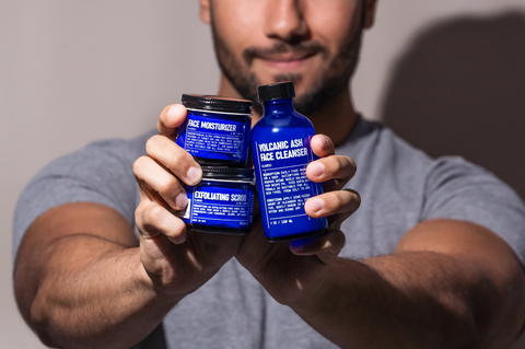 Image of man holding Blu Atlas Moisturizer, Scrub and FaceCleanser