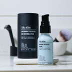 Blu Atlas Morning/Night Bundle features the Overnight Recovery Bio-Retinol Stick and Morning Recovery Serum for hydrated, firmer skin, shown on a white tray with a makeup brush and marble container in the background.