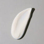 The Protect & Moisturize Duo by Blu Atlas features a dollop of white cream on a gray surface, delivering natural skincare benefits with UVA and UVB protection.