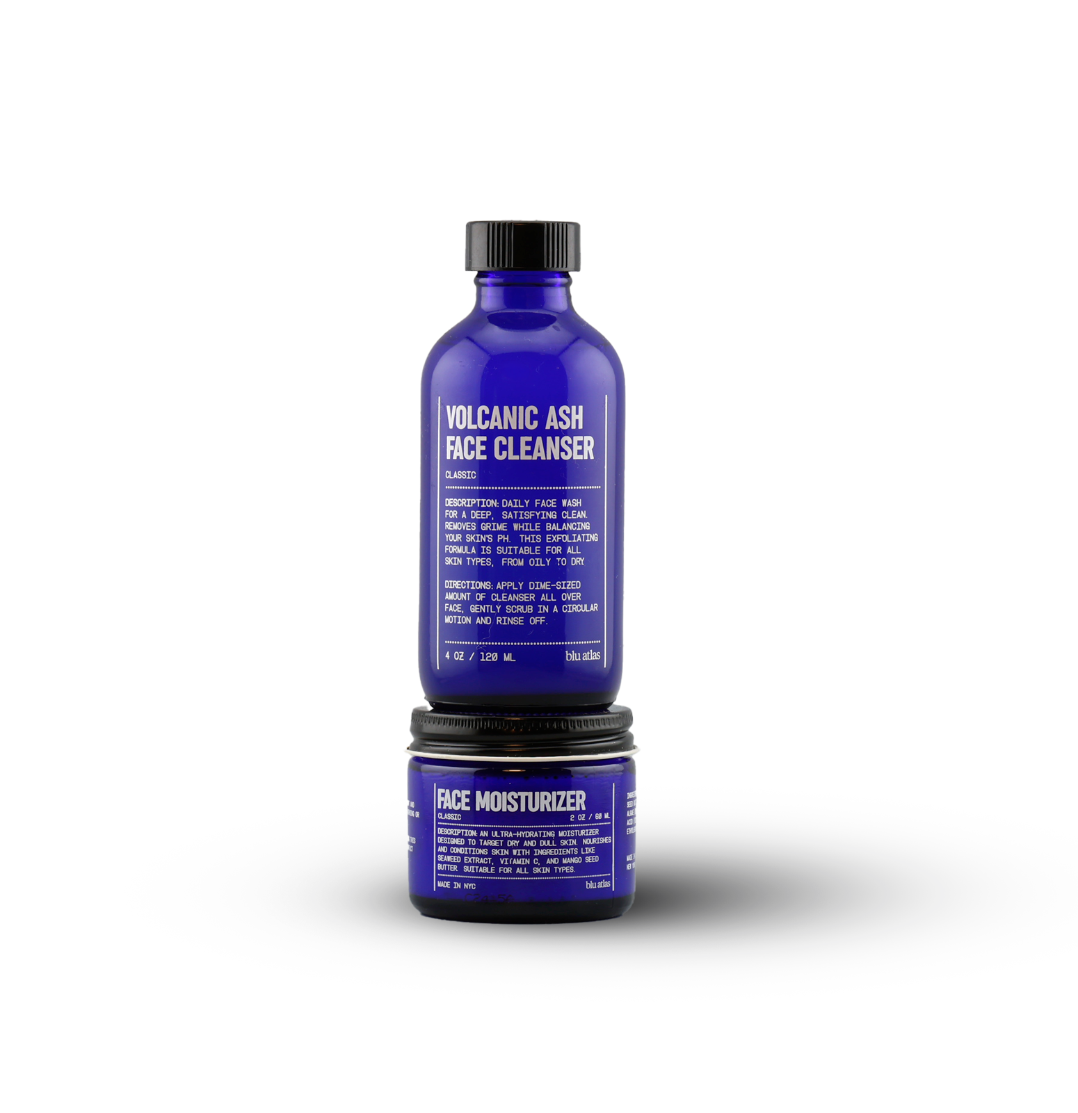 The Blu Atlas Clean and Hydrate Duo features two blue bottles—a Volcanic Ash Face Cleanser and a Face Moisturizer—displayed against a white background to cleanse and hydrate your skin for a balanced, refreshed look.