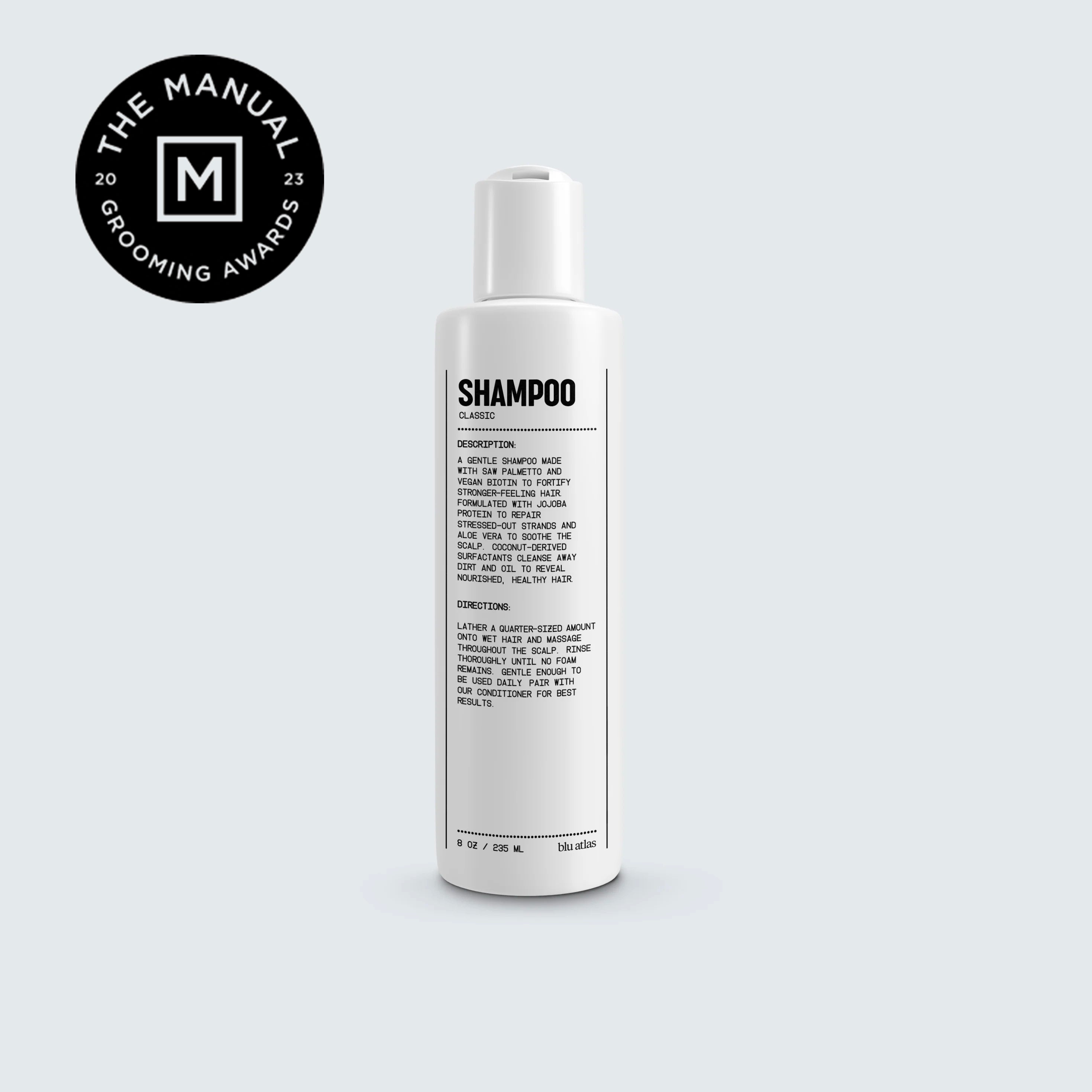Natural shampoo for all hair types bottle on grey background. 