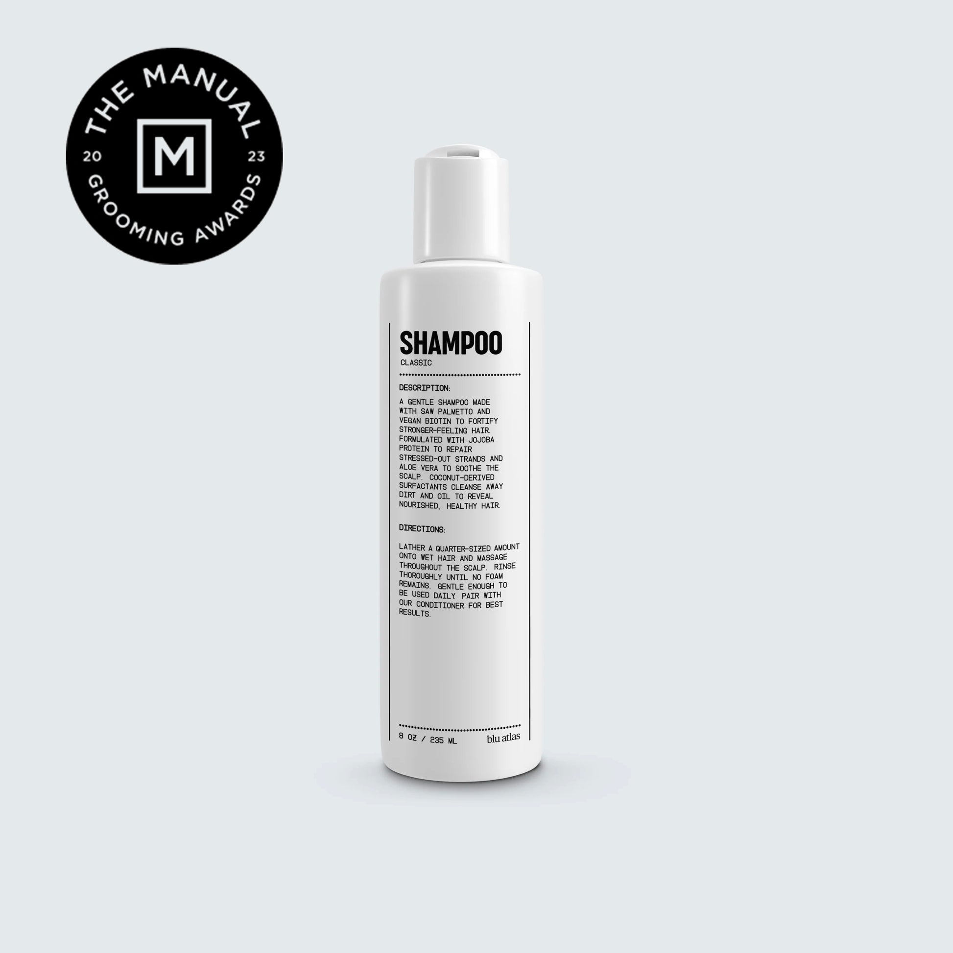 Natural shampoo for all hair types bottle on grey background. 