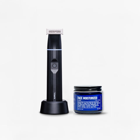 The Blu Atlas Winter Skin & Trim Bundle featuring an electric facial trimmer on its charging stand and a jar of face moisturizer, stands ready against a plain background to combat winter skin woes.