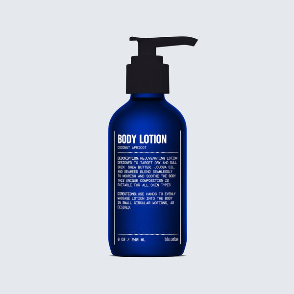 A blue pump bottle labeled "Blu Atlas Nourishing Body Lotion - Coconut Apricot" displays deep moisture benefits and usage instructions in white text on the front.