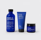 The Blu Atlas Summer Kit, featuring a volcanic ash cleanser, reef-safe mineral SPF 30, and lightweight moisturizer, is displayed against a plain background.