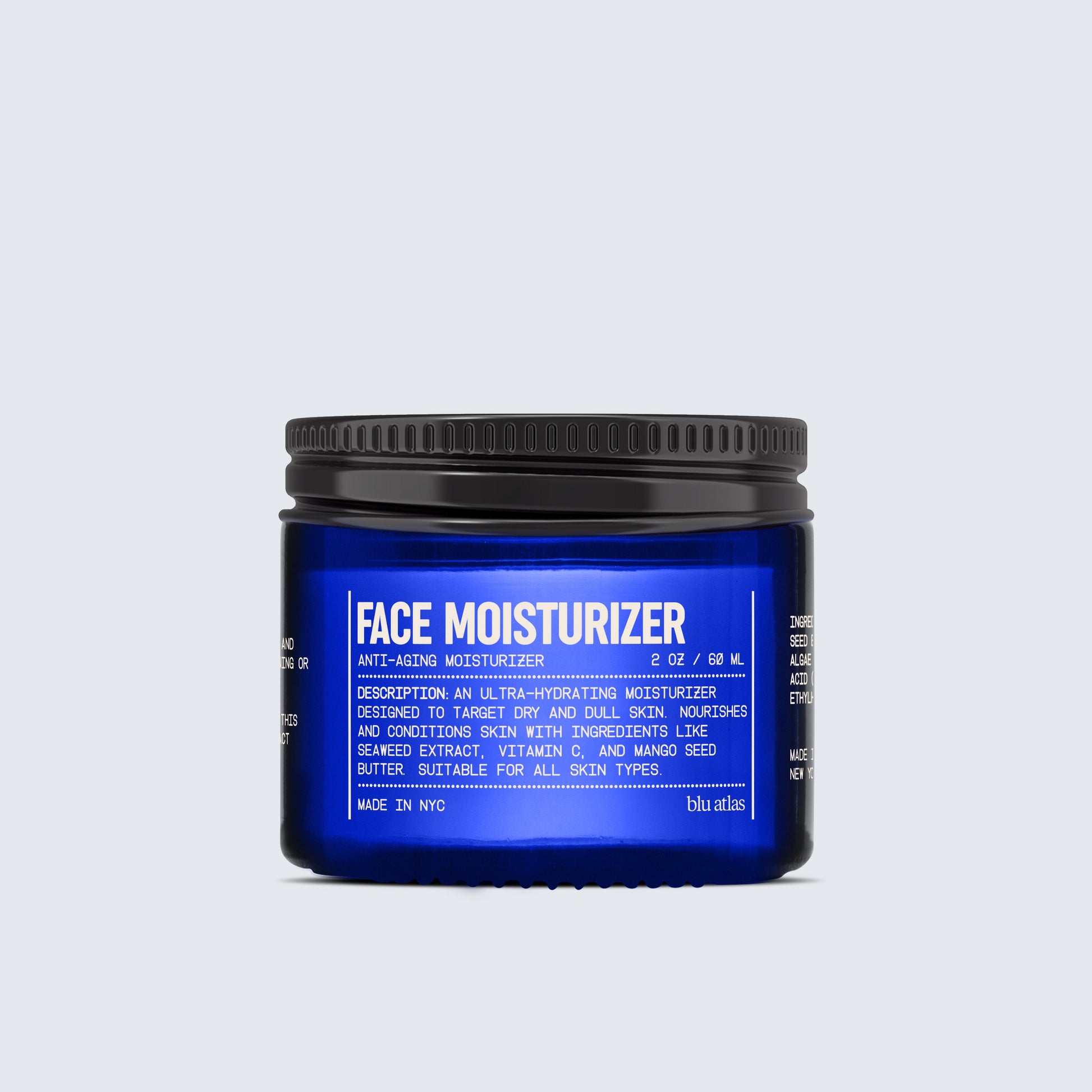 A jar of Blu Atlas Hydrating Face Moisturizer for All Skin Types, in dark blue, showcases a white label with product details and includes seaweed extract for anti-aging benefits.