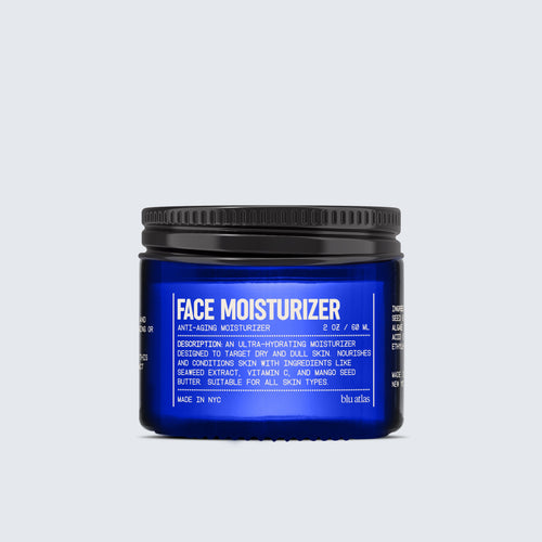 A blue jar labeled Natural Hydrating Face Moisturizer from Blu Atlas, featuring white text highlighting its anti-aging properties and suitability for all skin types, formulated with nourishing mango seed butter, set against a plain light background.