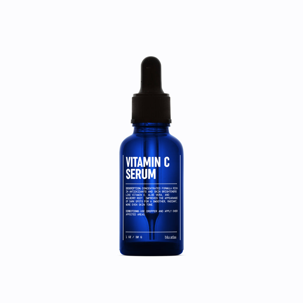 The Advanced Skincare Set from Blu Atlas includes a Vitamin C Serum in a blue bottle, complete with a dropper cap and white text listing product details, making it an ideal addition to your skincare routine.